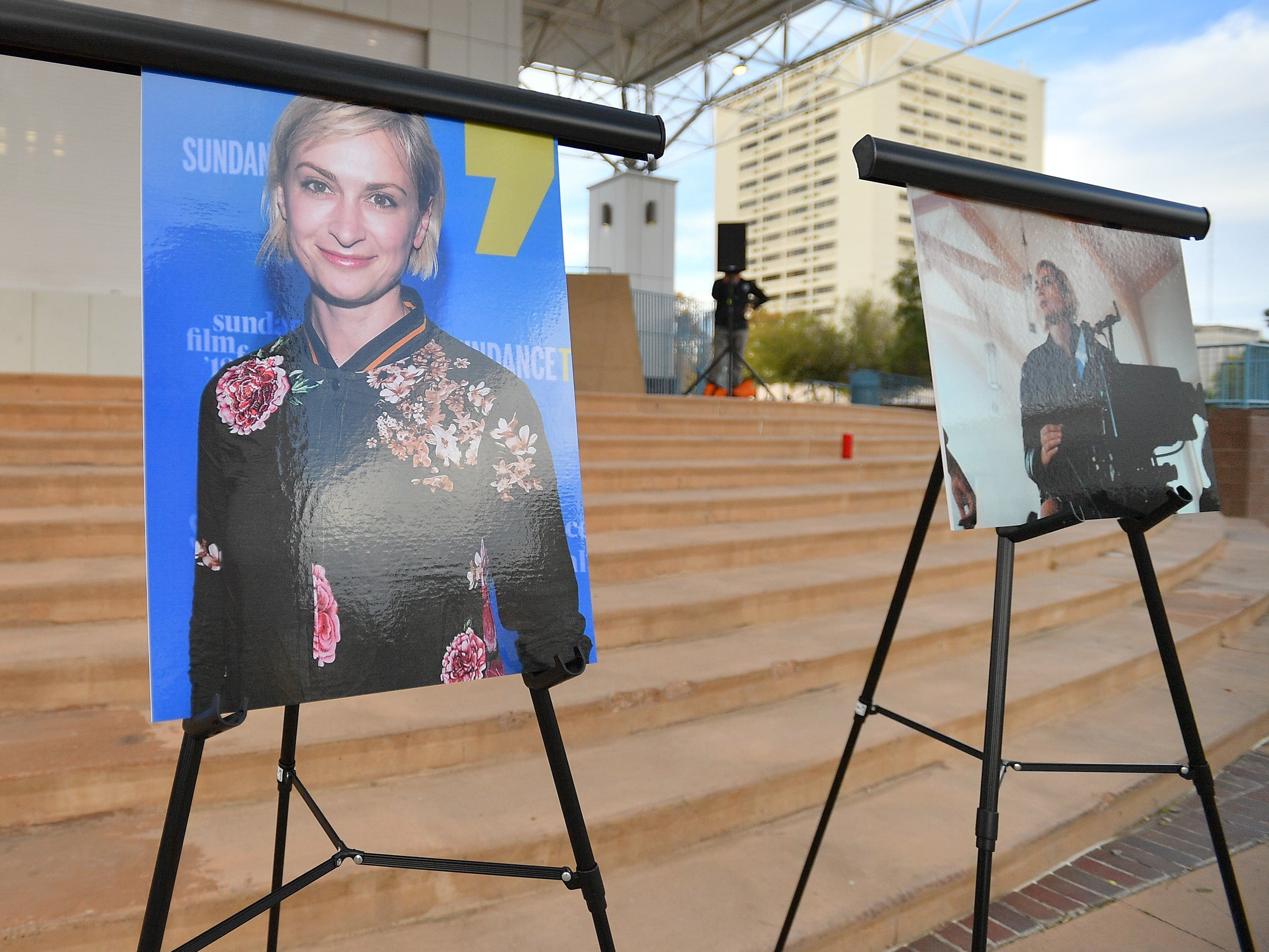 Photos of cinematographer Halyna Hutchins are displayed before a vigil held to honour her in New Mexico