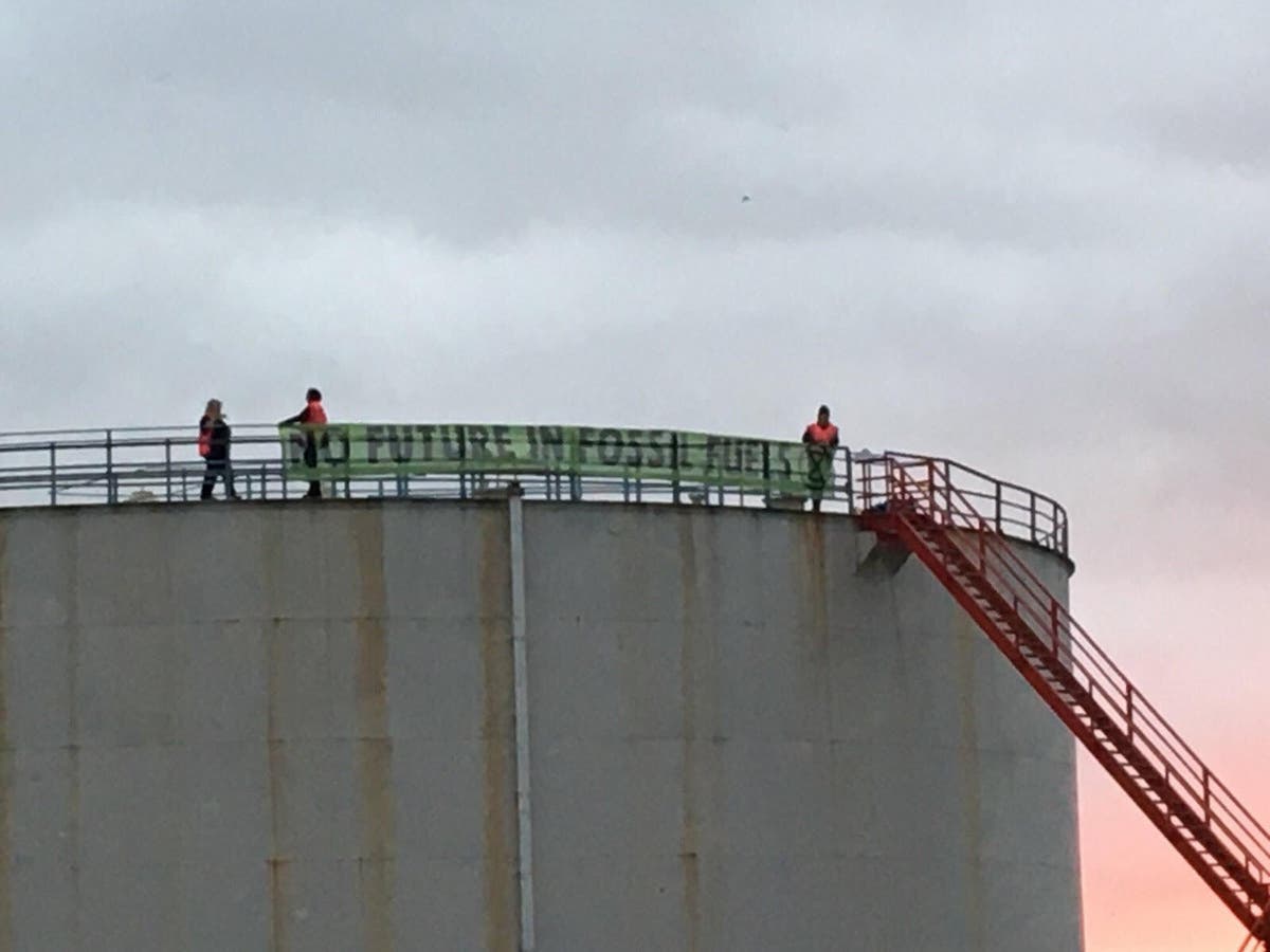 Extinction Rebellion break into Fawley oil refinery in Hampshire and climb silos