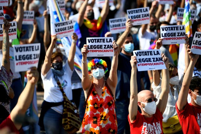 <p>People gather for a protest in support of a proposed anti-discrimination bill that makes violence against LGBT+ people a hate crime in Milan earlier this year</p>