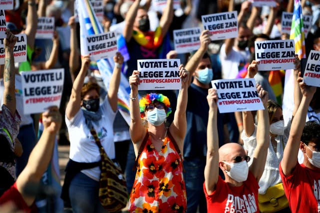 <p>People gather for a protest in support of a proposed anti-discrimination bill that makes violence against LGBT+ people a hate crime in Milan earlier this year</p>