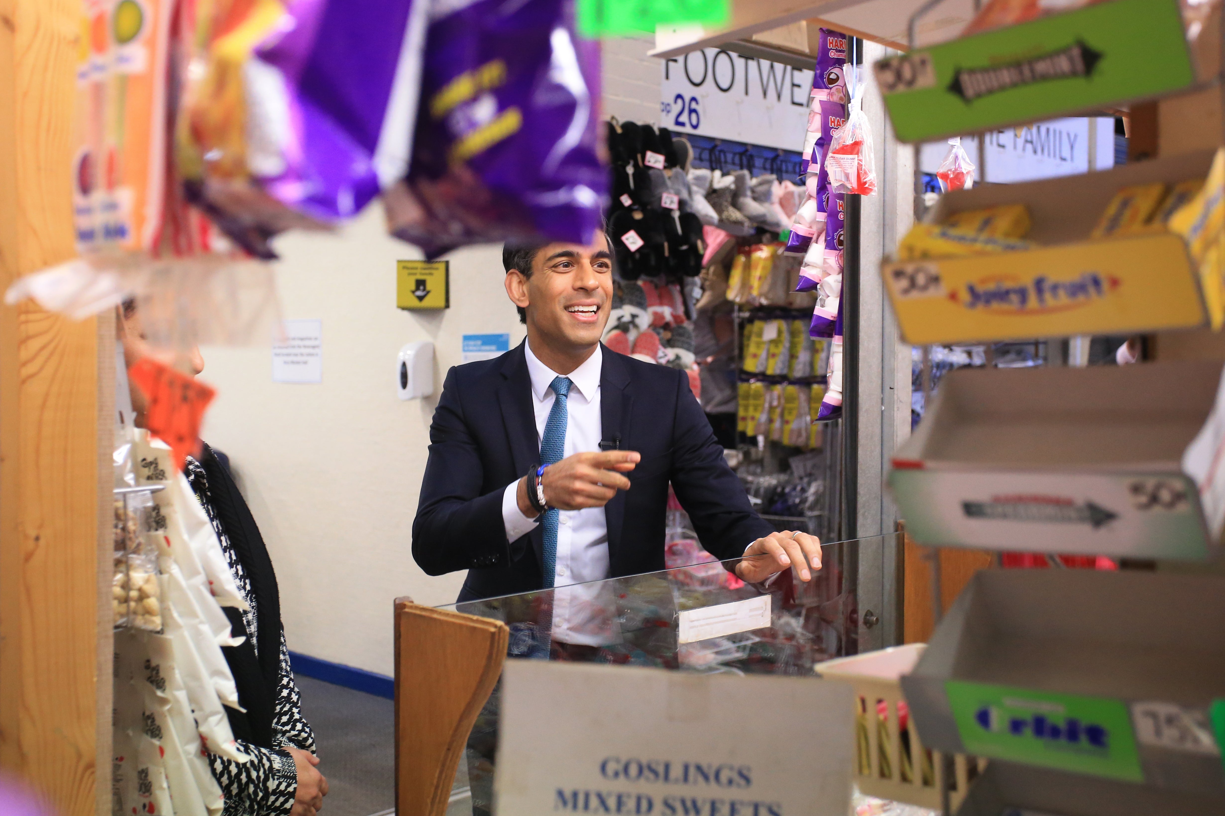 Chancellor Rishi Sunak at a sweet shop during a visit to Bury market in Lancashire