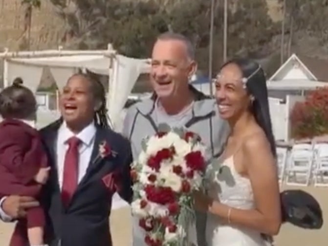 Tom Hanks crashes wedding and poses with newlyweds