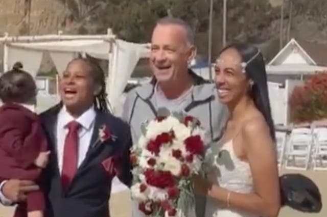 <p>Tom Hanks crashes wedding and poses with newlyweds</p>