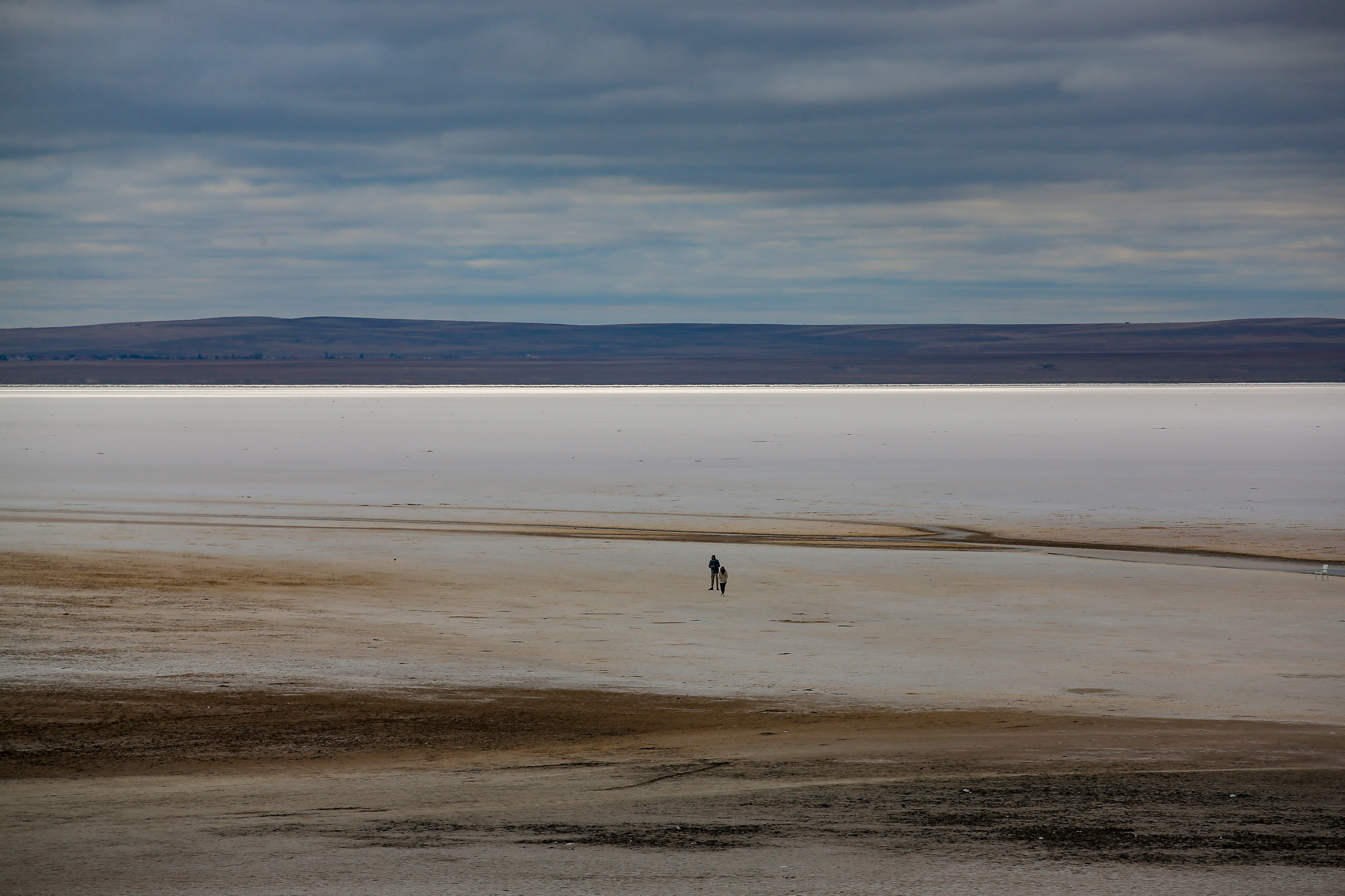 A man walks along Tuz lake in Ankara province