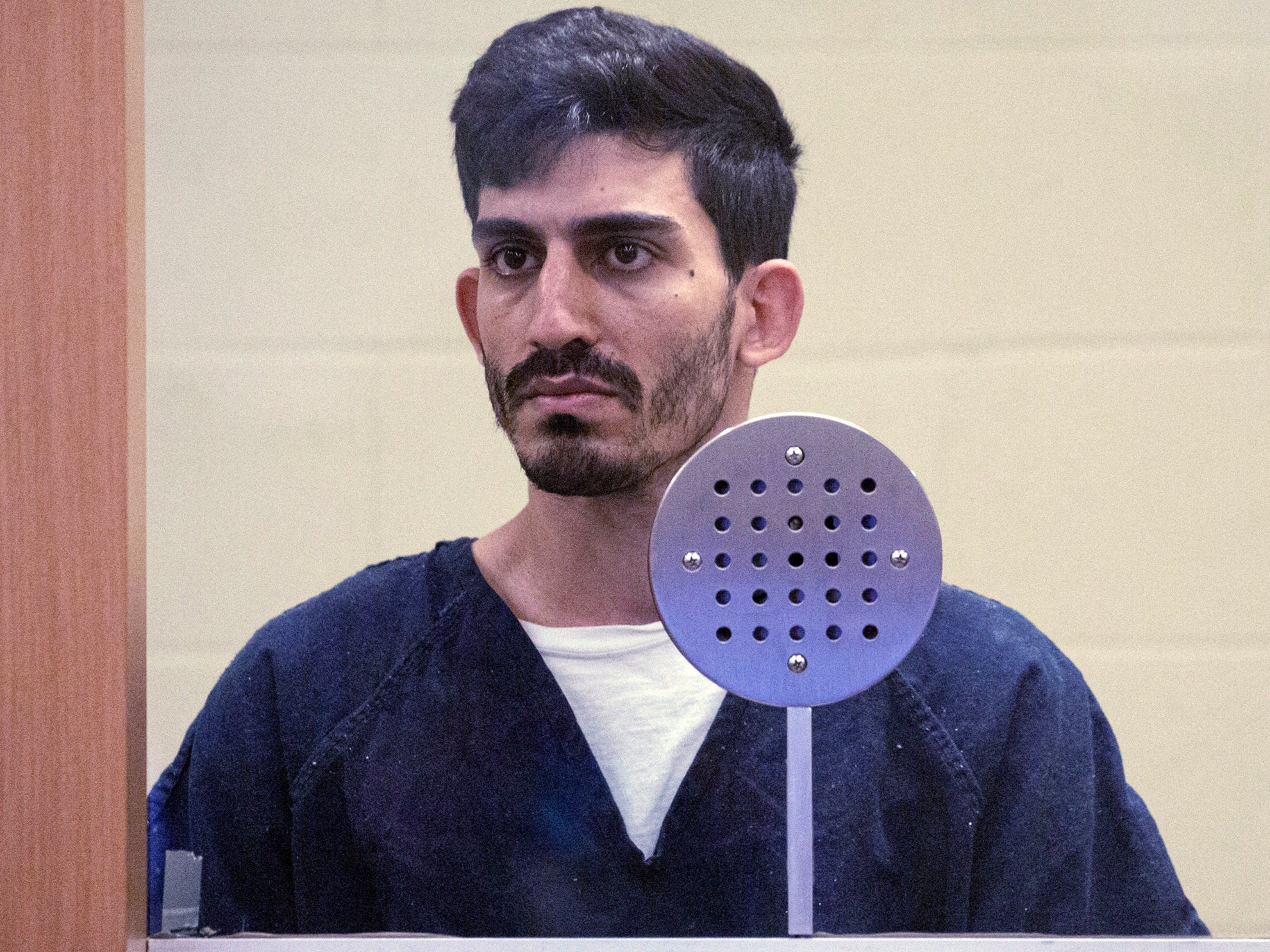 Ali Abulaban, 29, stands during his arraignment for a double homicide at the San Diego Central Courthouse on Monday, Oct. 25, 2021 in San Diego