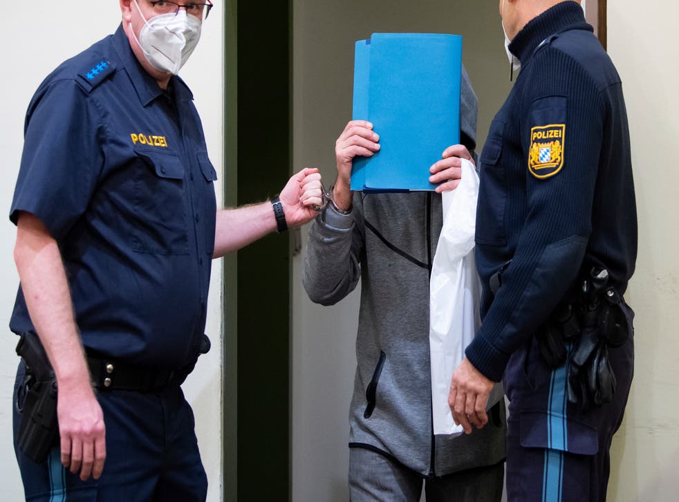 <p>The 66-year-old accused of murder by omission arrives in the courtroom before his trial begins in Munich, Germany </p>