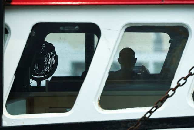 <p>A crew member of a British trawler Cornelis moored in Le Havre</p>
