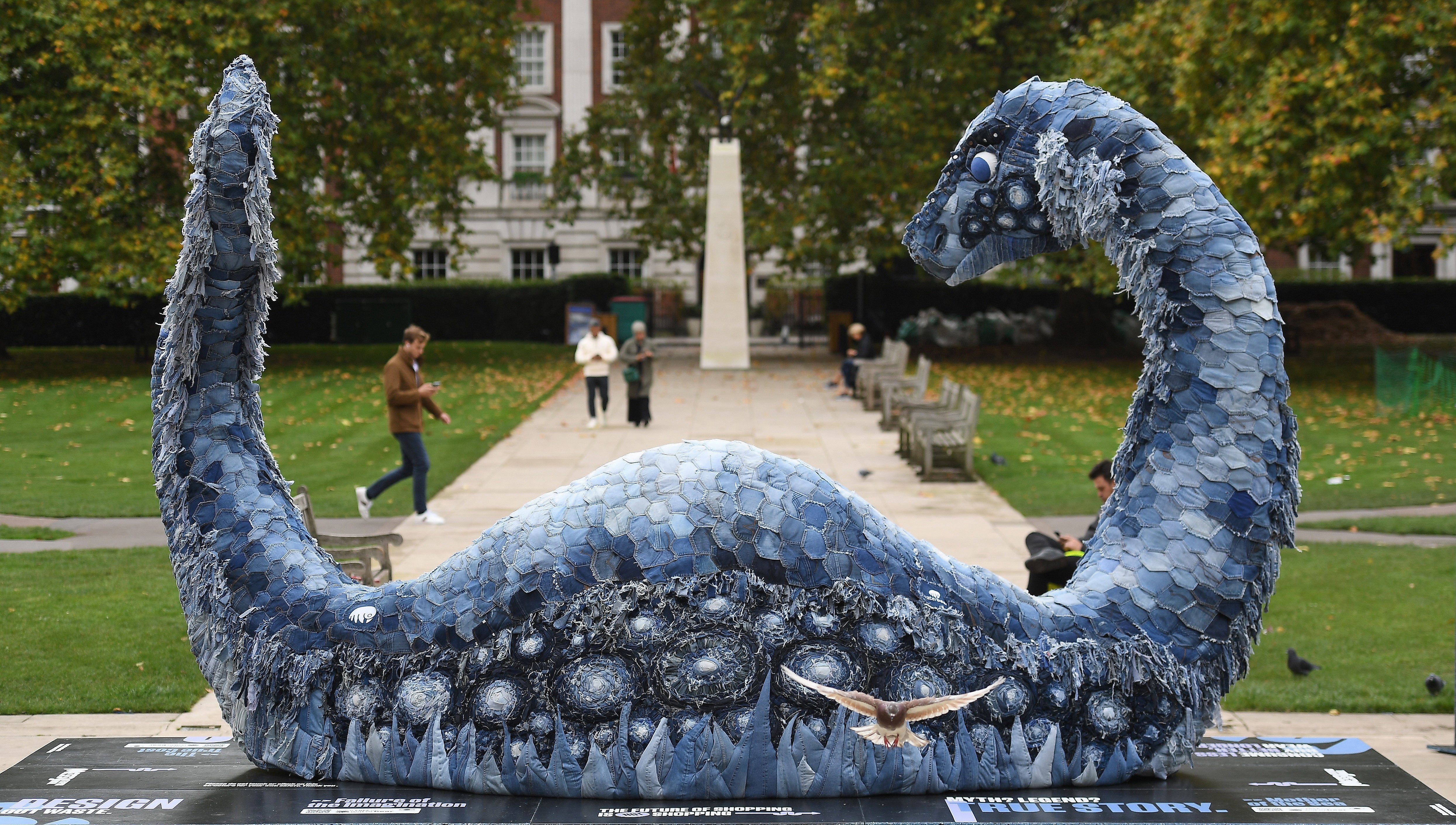 The artwork is attempting to highlight the polluting effects that denim has on the environment