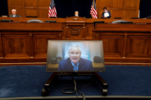 <p>Darren Woods, chief executive of ExxonMobil, appears before the House oversight panel last year  </p>