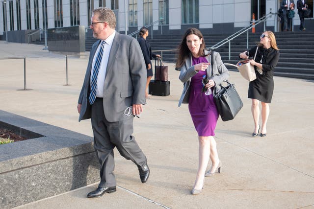 <p>FILE - Attorneys and staff associated with a federal trial of pharmacies, CVS, Walgreens, Giant Eagle and Walmart leave the Carl B. Stokes Federal Courthouse in Cleveland, Monday, Oct. 4, 2021.</p>