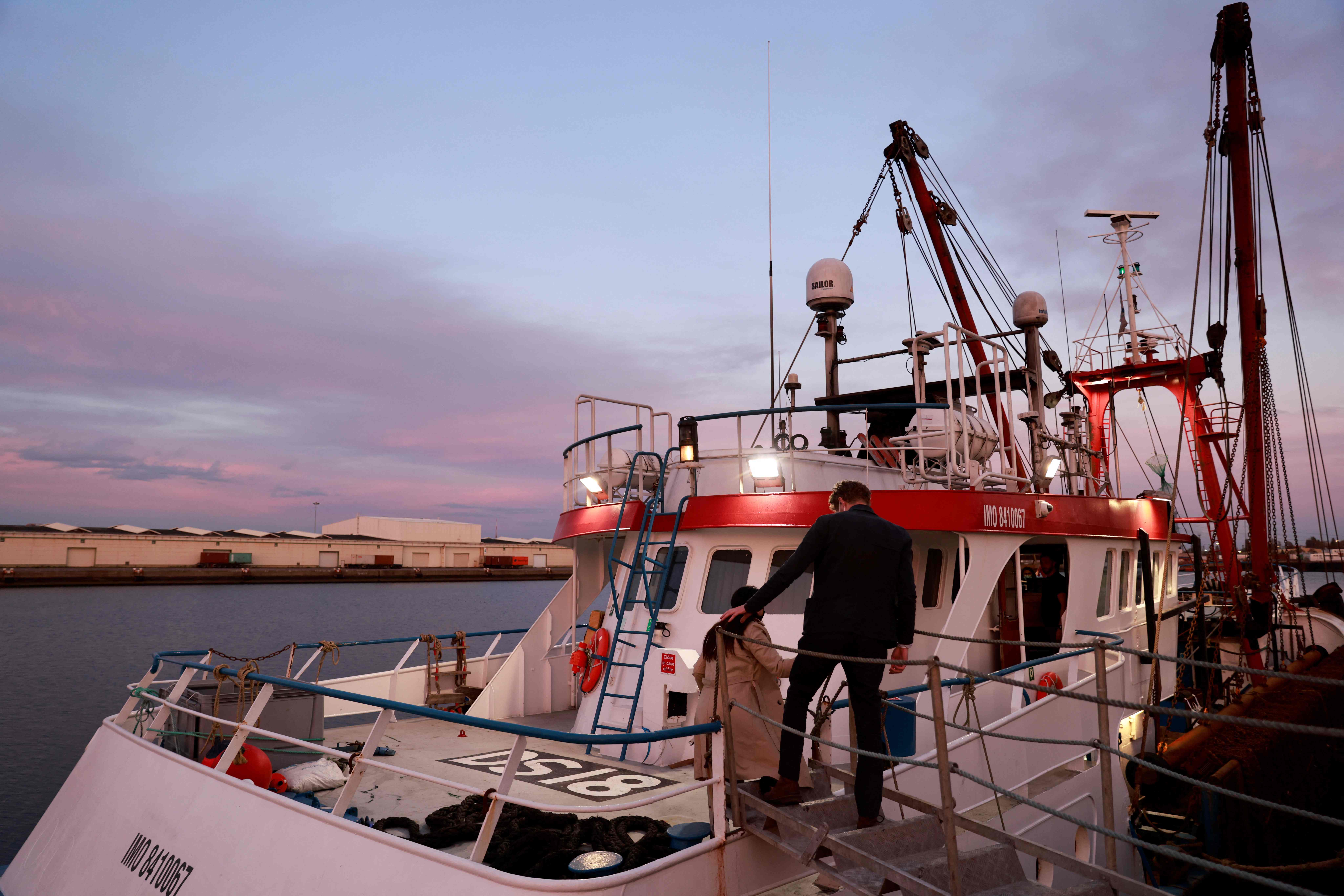UK embassy officials arrive at the British trawler detained in Le Havre