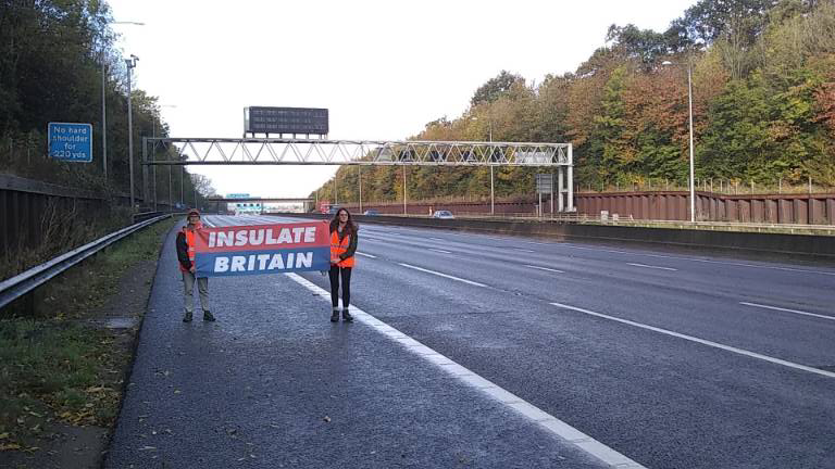 Insulate Britain protesters walking along the M25 on Friday.