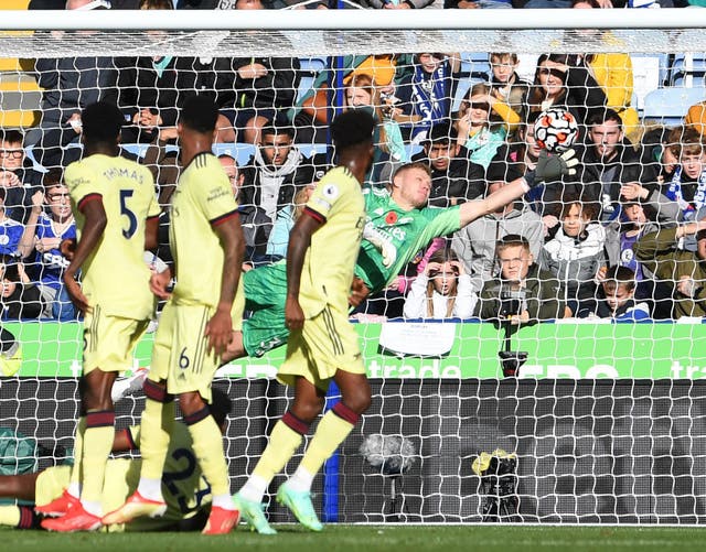 <p>Aaron Ramsdale flicks a James Maddison free kick onto the crossbar, the highlight of the Arsenal goalkeeper’s defiant display</p>