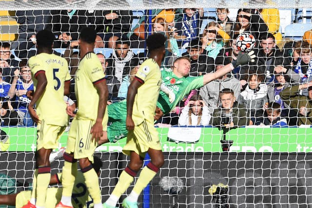 <p>Aaron Ramsdale flicks a James Maddison free kick onto the crossbar, the highlight of the Arsenal goalkeeper’s defiant display</p>