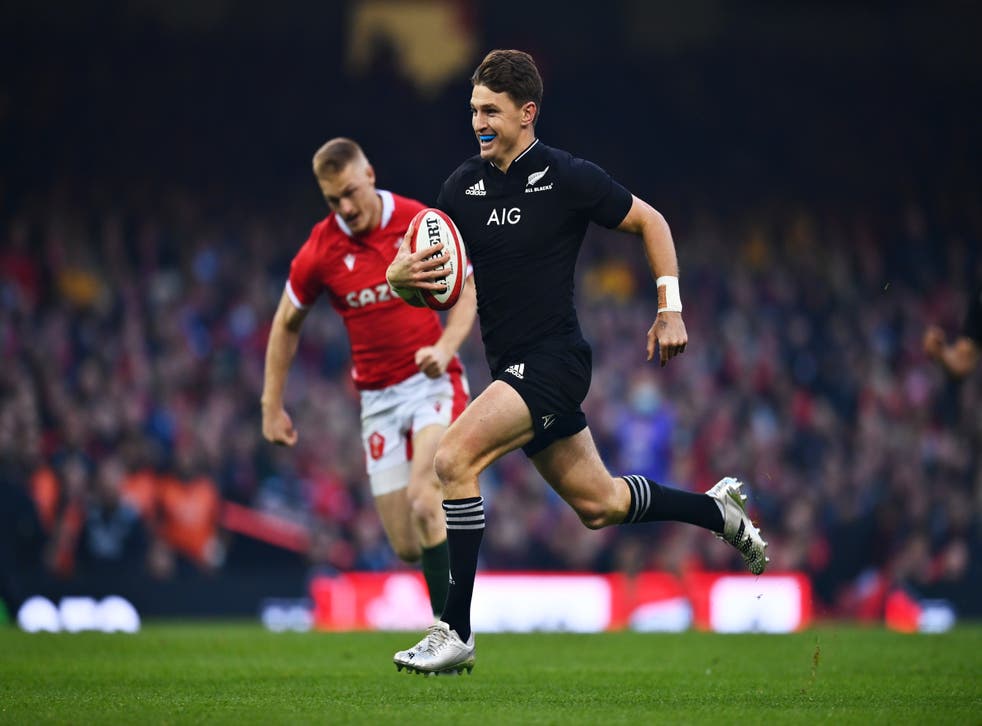 <p>Beauden Barrett smiles as he runs in the first try</p>