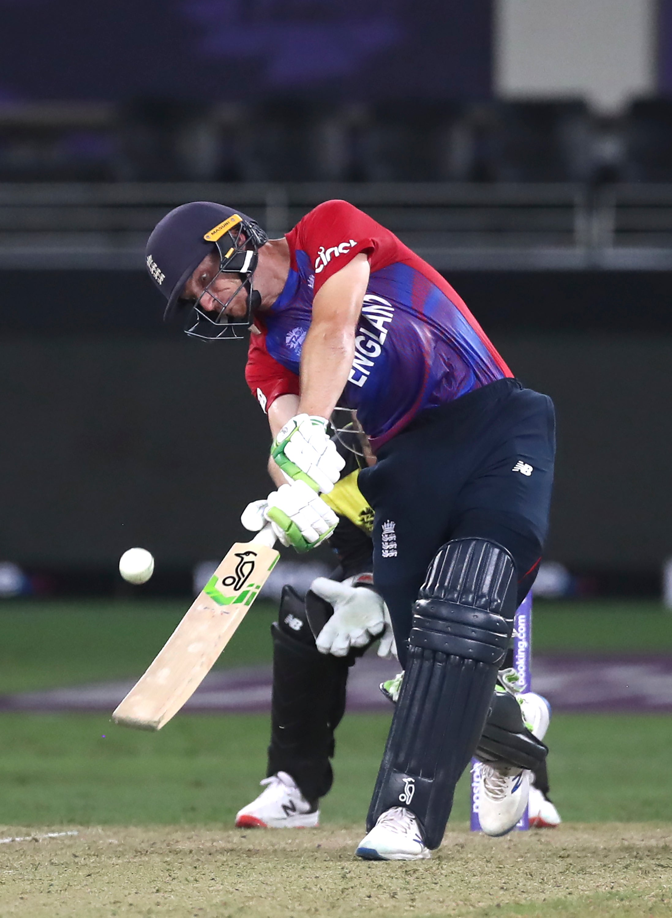 Jos Buttler hits a six during the win over Australia (Aijaz Rahi/AP/PA)