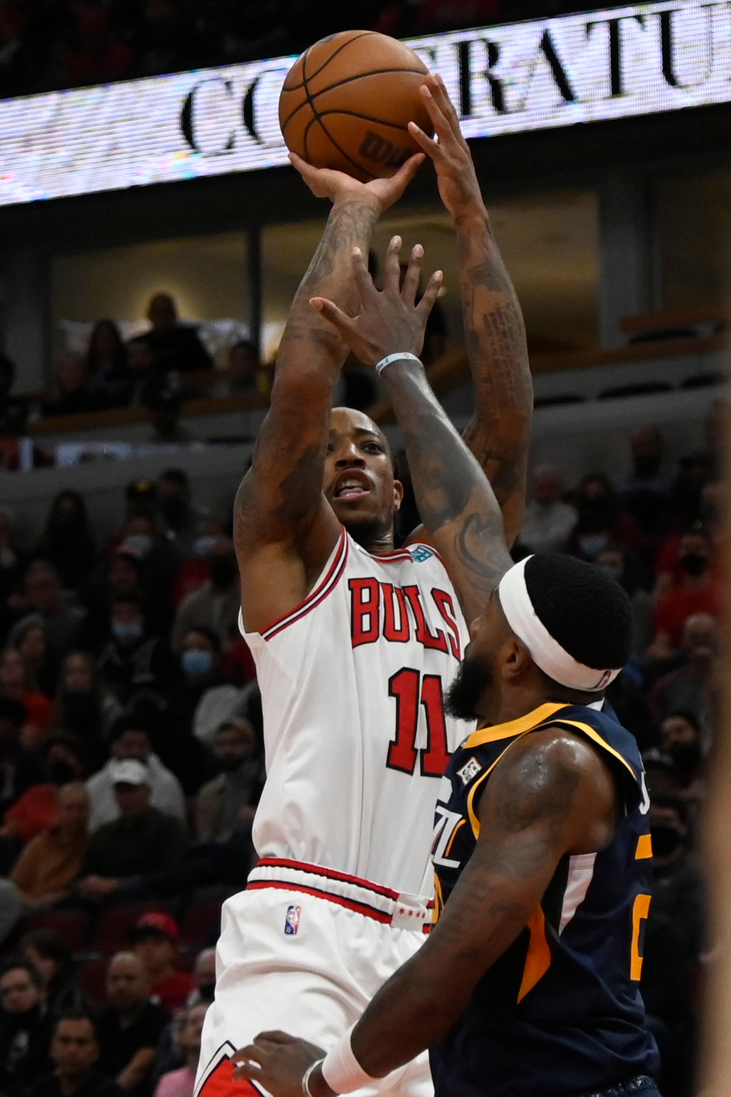 Chicago Bulls forward DeMar DeRozan shoots against Utah Jazz forward Royce O’Neale (Matt Marton/AP)