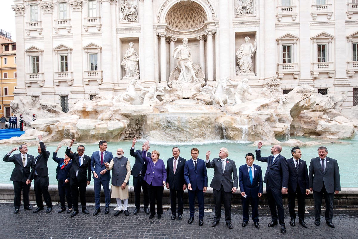 The Latest: G20 leaders toss coins into Trevi Fountain