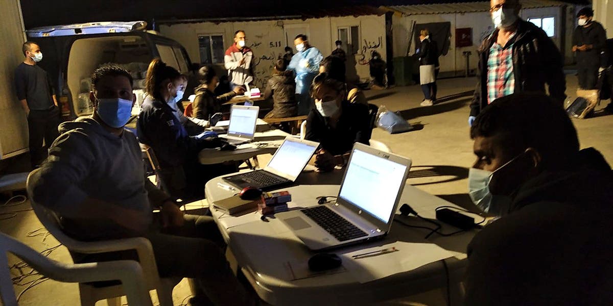 Adrift freighter carrying migrants towed to Greek island