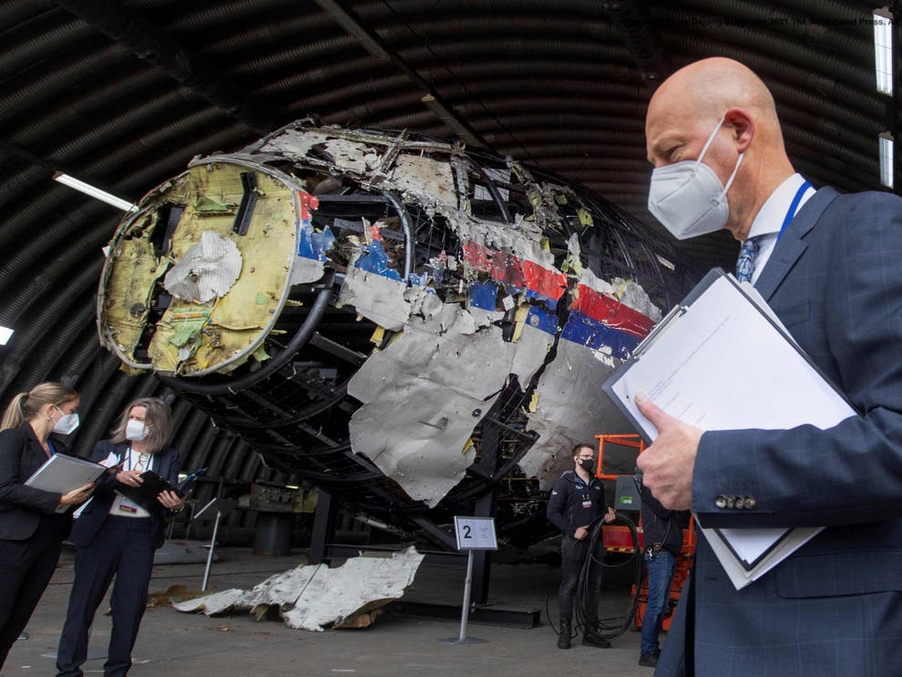 Dutch judge Hendrik Steenhuis views the reconstructed wreckage of Malaysia Airlines Flight MH17 at the Gilze-Rijen military airbase (AFP/Getty)
