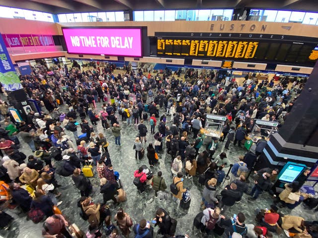 <p>Hundreds of passengers hoping to travel to Glasgow for the Cop26 climate summit by train are left waiting at London’s Euston station on Sunday </p>