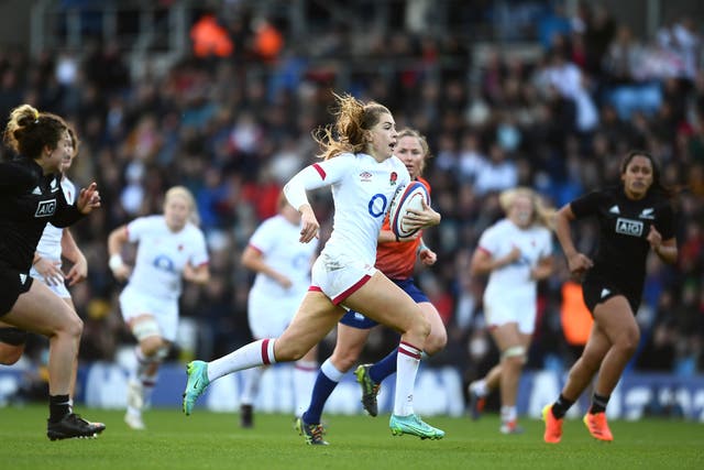 <p>Holly Aitchison of England breaks away before scoring their side's fifth try</p>