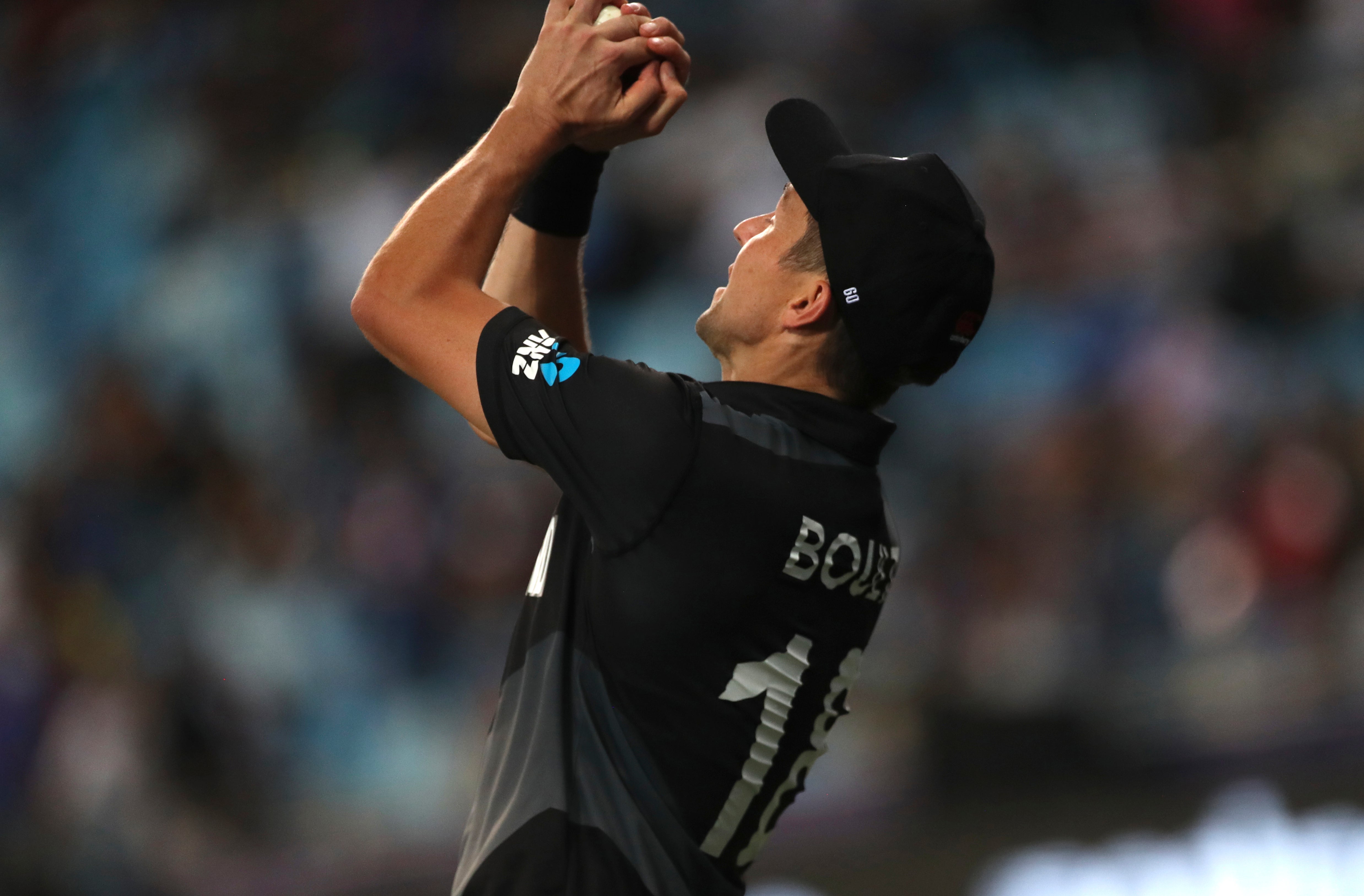 Trent Boult takes the catch to dismiss India captain Virat Kohli as New Zealand beat India (Aijaz Rahi/AP)