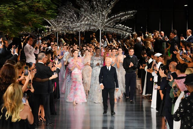 <p>Italian fashion designer Giorgio Armani walks the runway during the Giorgio Armani “One Night Only Dubai” fashion show at the Armani Hotel Dubai</p>
