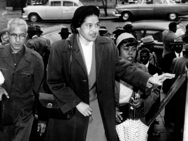 <p>Rosa Parks arriving at court in February 1956 to be arraigned after she refused to give up her seat on a bus to a white man</p>
