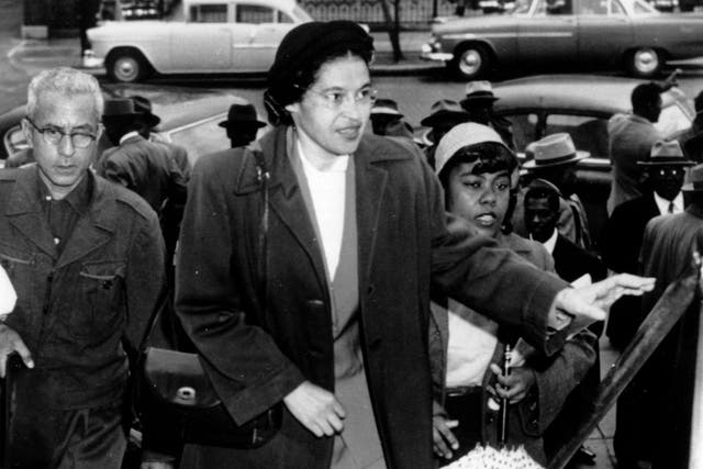 <p>Rosa Parks arriving at court in February 1956 to be arraigned after she refused to give up her seat on a bus to a white man</p>
