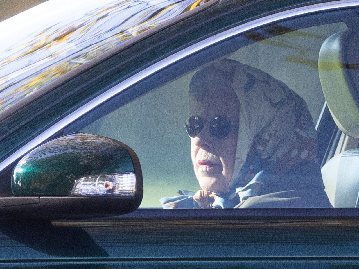 The Queen pictured driving herself around her Windsor estate