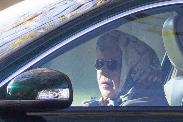 <p>The Queen pictured driving herself around her Windsor estate </p>