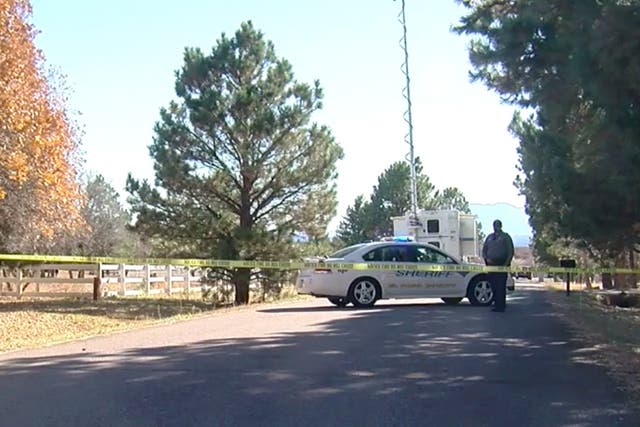 <p>Police at scene of suspected murder-suicide in Colorado on 30 October</p>