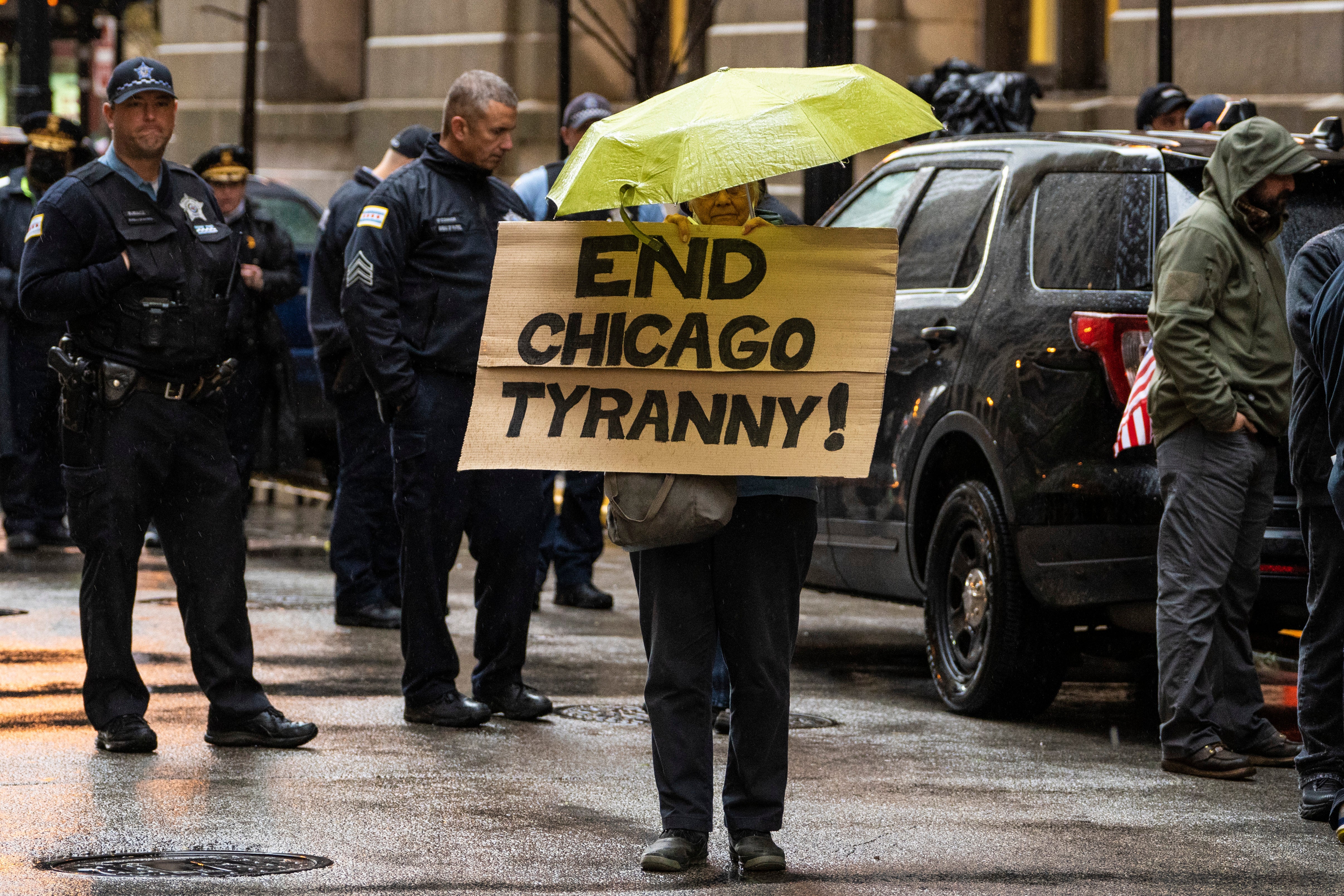 Fraternal Order of Police Lodge 7 members and their supporters protest against Covid-19 vaccine mandates outside City Hall before a Chicago City Council meeting, on 25 October, 2021