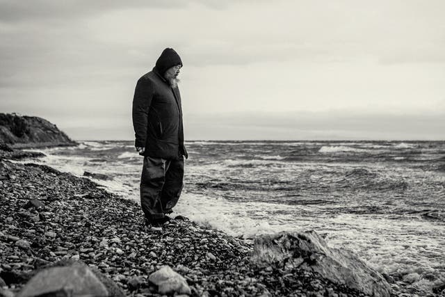 <p>The activist on the shore of Lesbos in 2016, where he set up a studio to highlight the plight of refugees </p>