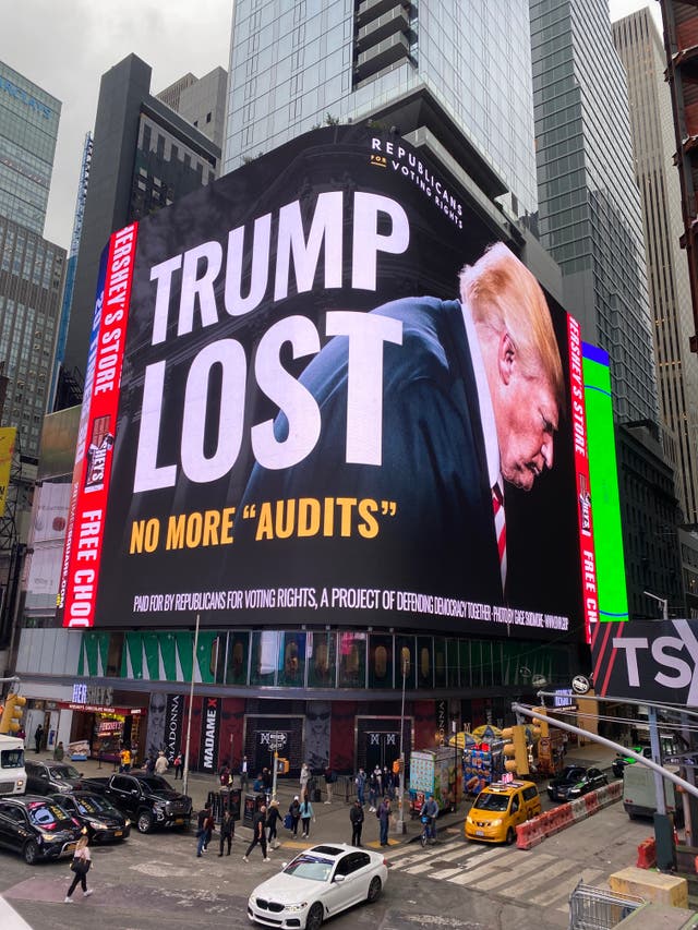 <p>A ‘Trump lost’ billboard is seen in New York’s Times Square</p>