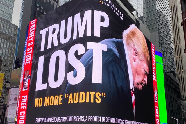 <p>A ‘Trump lost’ billboard is seen in New York’s Times Square</p>