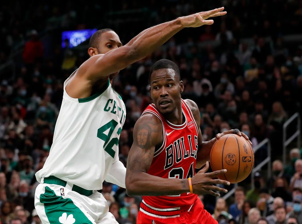 Chicago Bulls’ Javonte Green, right, drives past Boston Celtics’ Al Horford (Michael Dwyer/AP)