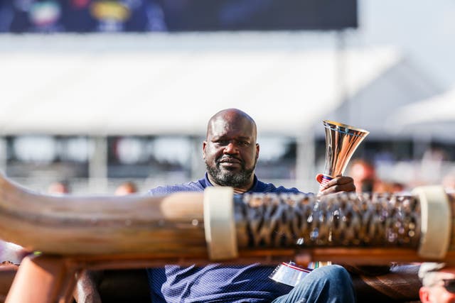 <p>Shaquille O’Neal presents the trophy at the recent US Grand Prix</p>