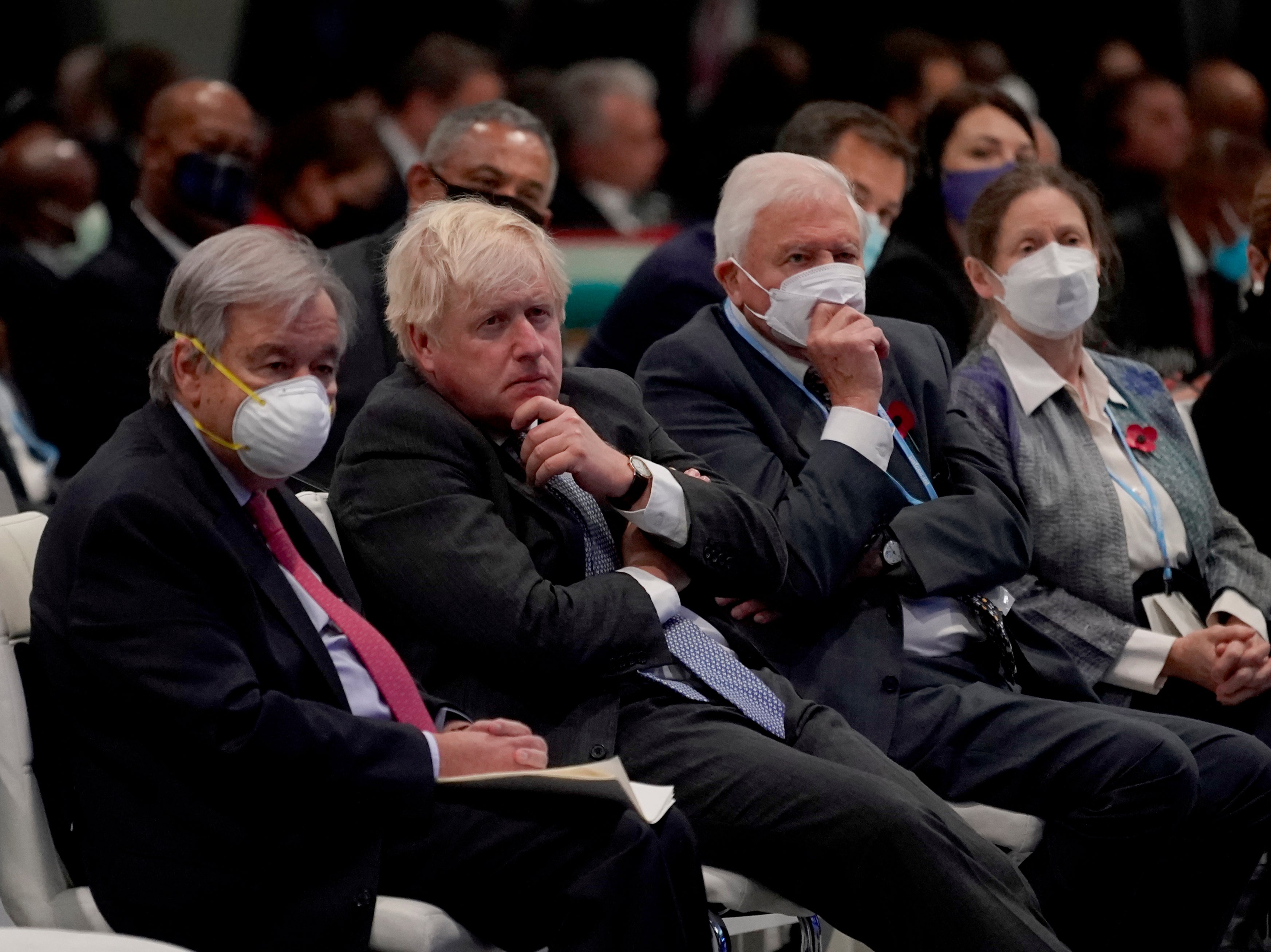 Boris Johnson sits alongside the UN secretary-general, Antonio Guterres, and British broadcaster and naturalist Sir David Attenborough at the Cop26 summit