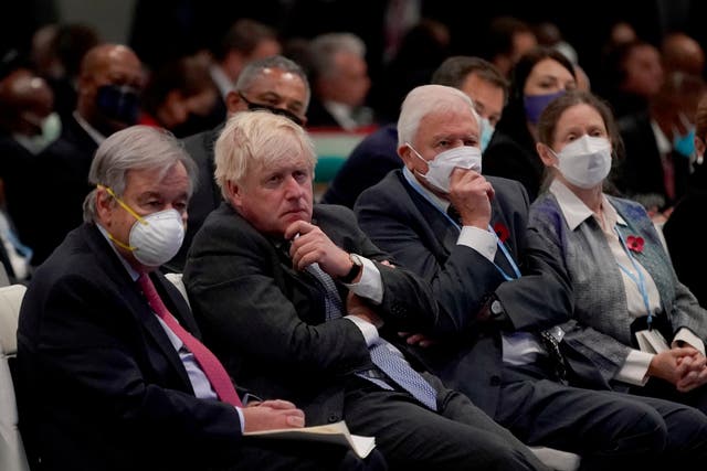 <p>Boris Johnson sits alongside the UN secretary-general, Antonio Guterres, and British broadcaster and naturalist Sir David Attenborough at the Cop26 summit</p>