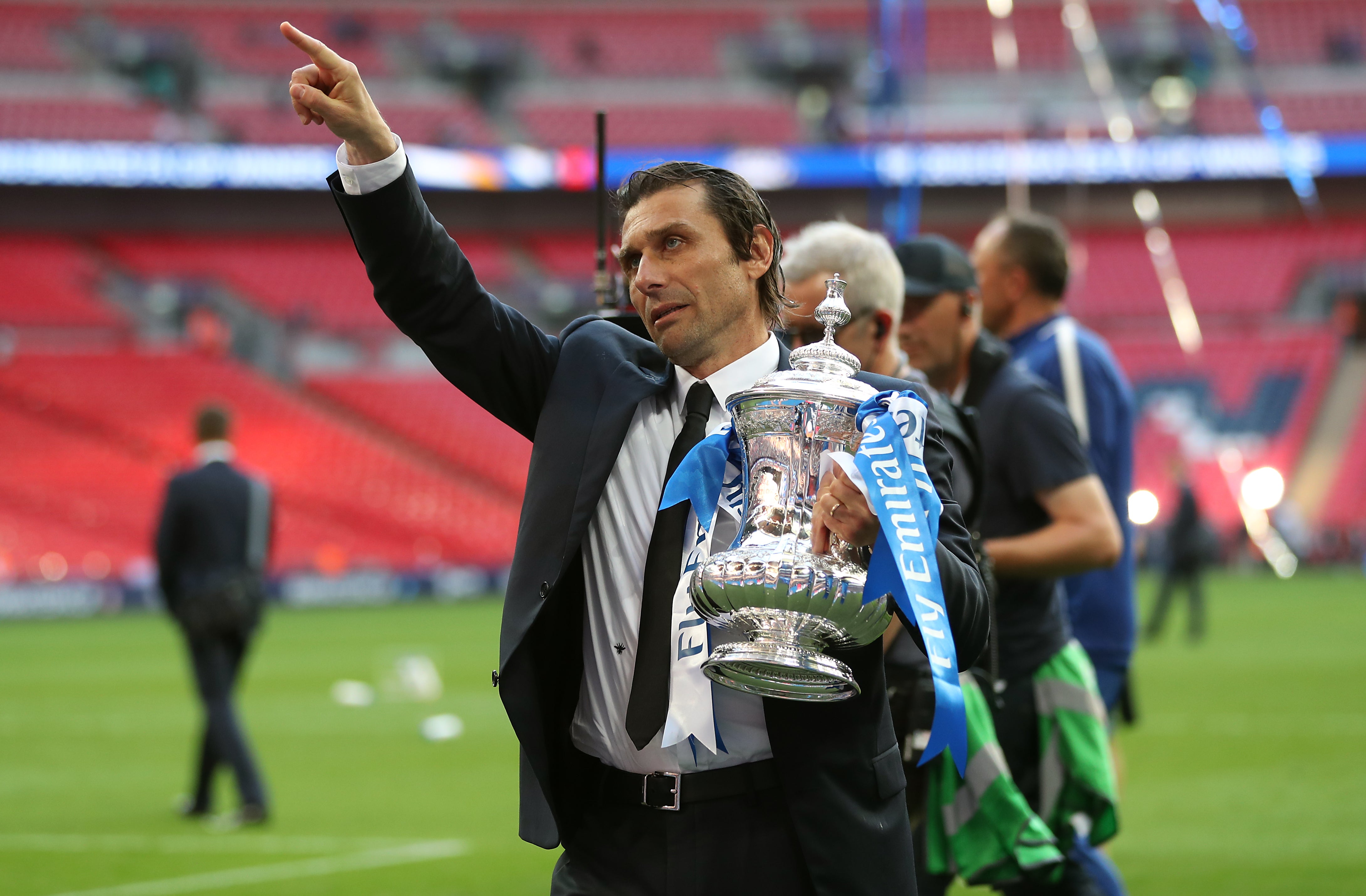 Former Chelsea manager Antonio Conte celebrated with the FA Cup after victory over Manchester United at Wembley (David Davies/PA)