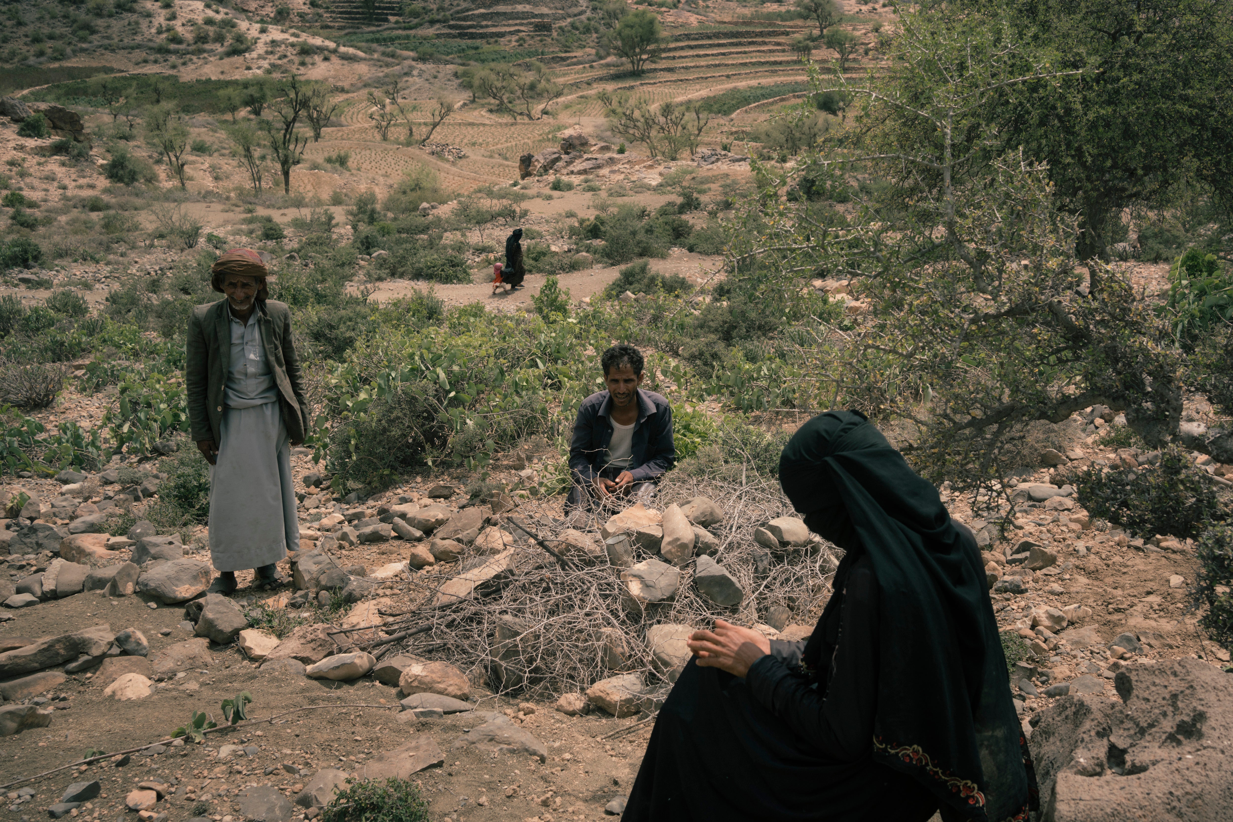 Mohammed and his wife Anisa Ali Mohammed sit near the grave of their son Ali