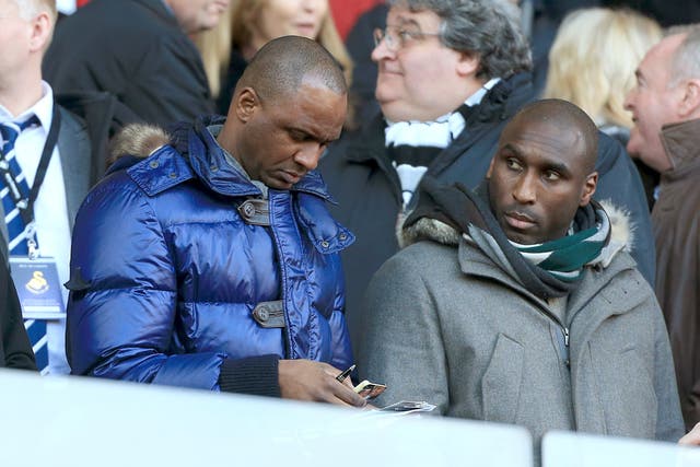 Sol Campbell (right) plans to learn from Patrick Vieira (Nick Potts/PA)