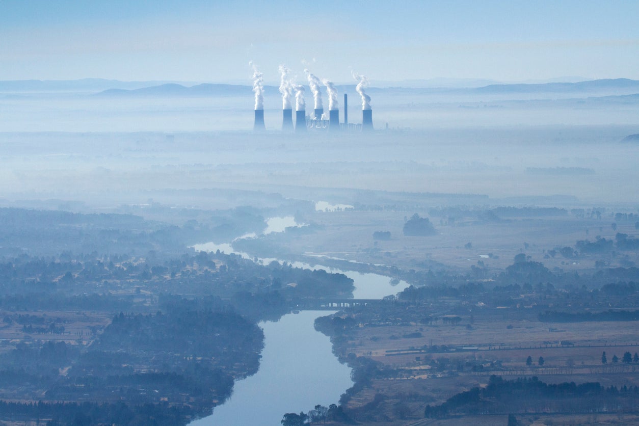 <p>An aerial view of a coal fired power station on the Vaal River, Freestate province. South Africa</p>