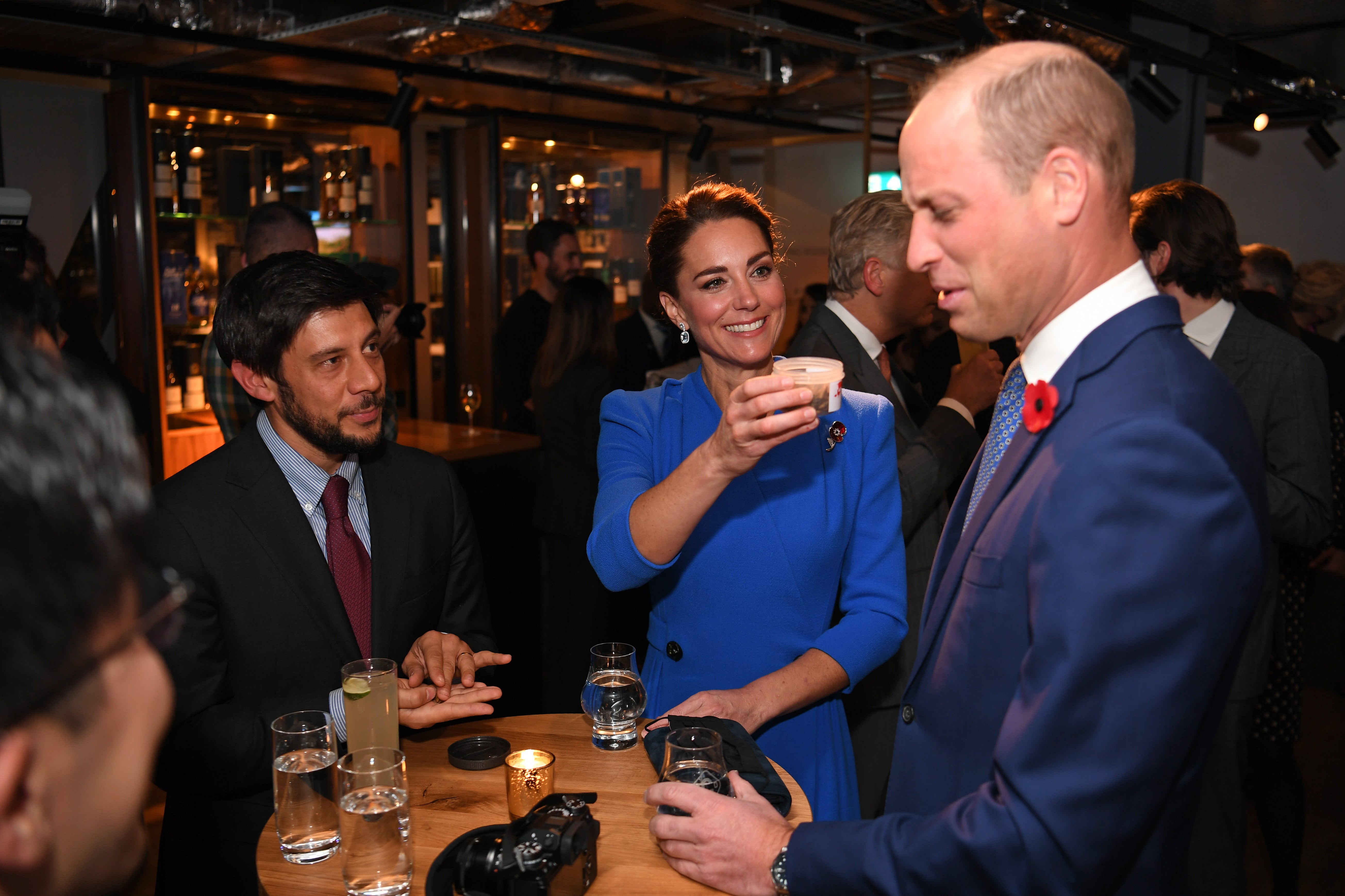 Prince William grimaces as Kate Middleton offers him a jar of dead bugs