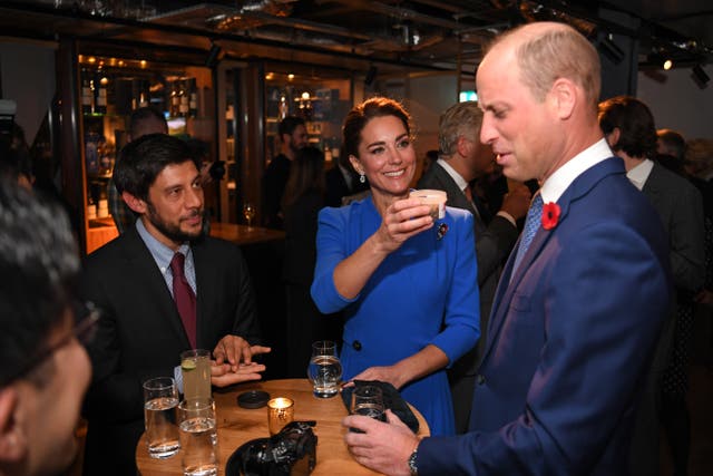 <p>Prince William grimaces as Kate Middleton offers him a jar of dead bugs</p>