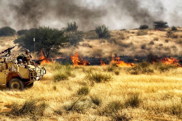 <p>A Jackal reconnaissance armoured vehicle from the Queen’s Dragoon Guards fleeing bush fire on patrol</p>