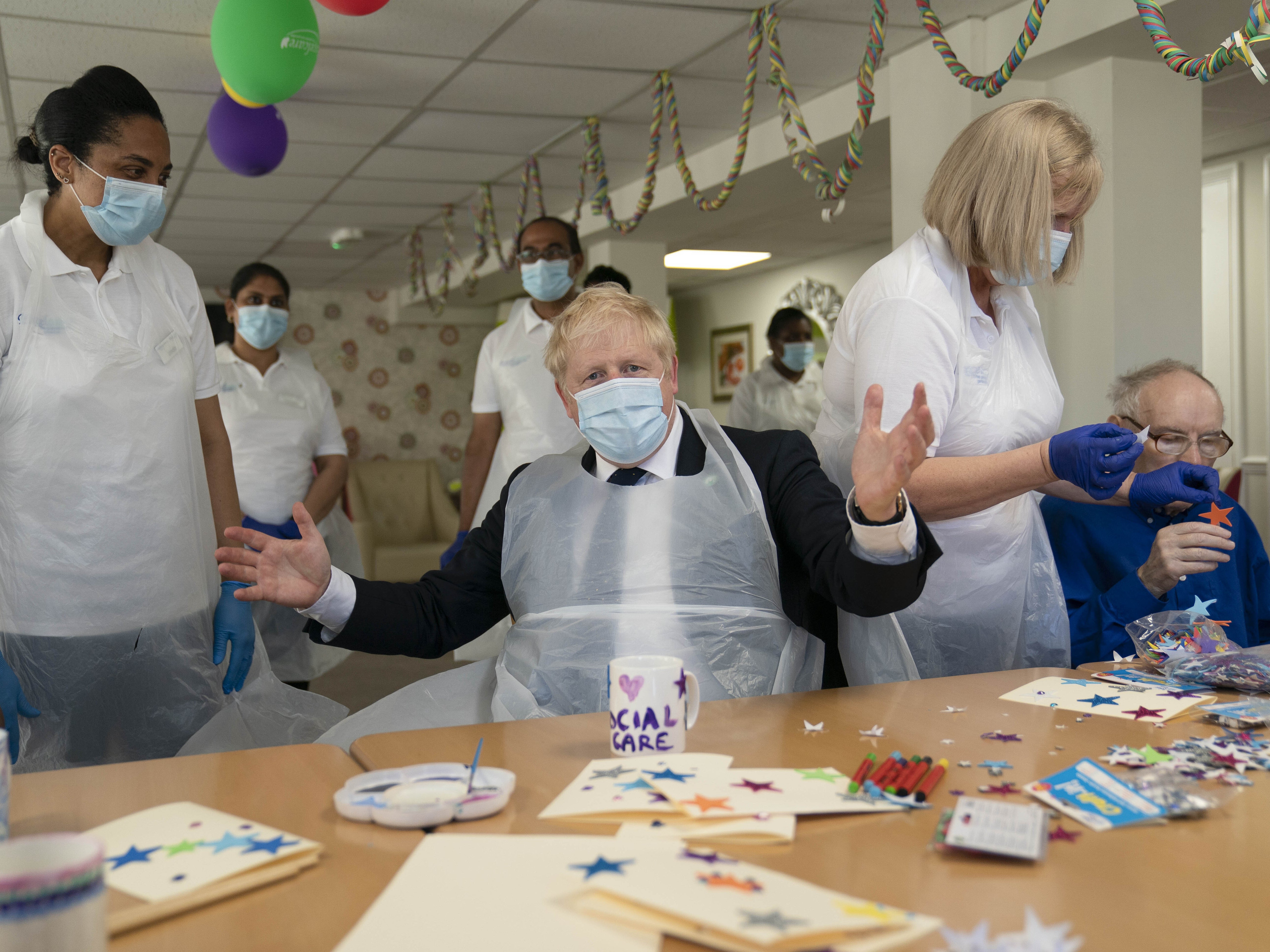 Boris Johnson during a visit to Westport Care Home in Stepney Green
