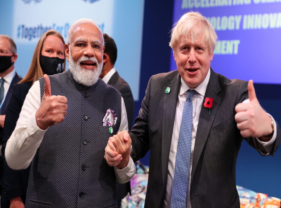 <p>Indian prime minister Narendra Modi and UK’s Boris Johnson pose on day three of Cop26 in Glasgow </p>